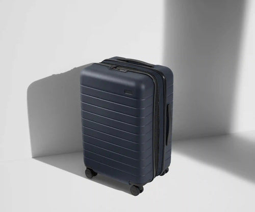 The Bigger Carry-On Flex in Navy Blue