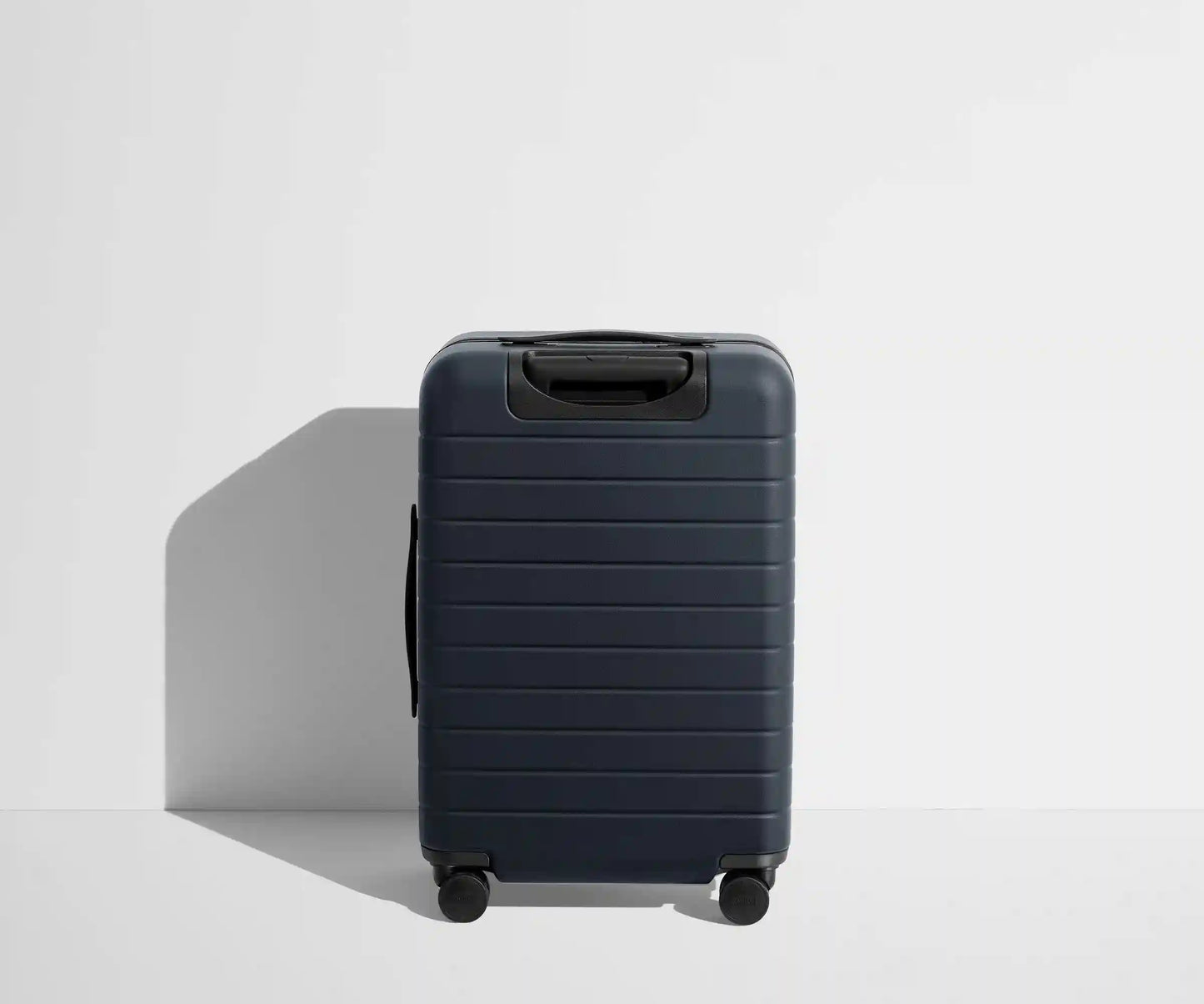 The Bigger Carry-On Flex in Navy Blue